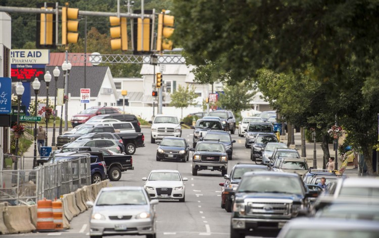 Traffic flows along Main Street in Waterville on Friday.