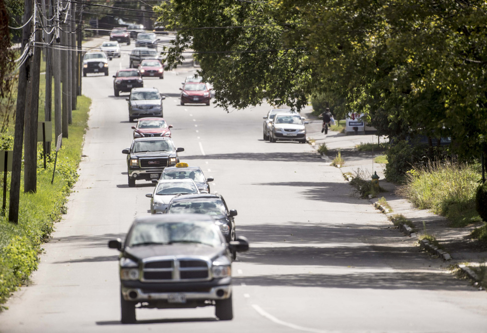 Traffic flows along Front Street in Waterville on Friday.