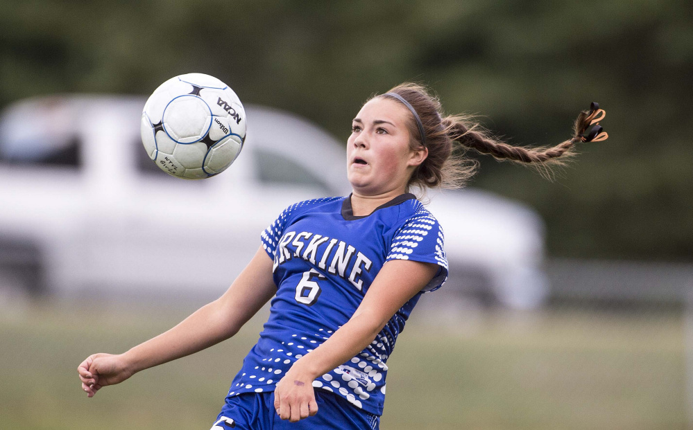 Erskine's Lauren Wooden traps the ball in a Class B North game against Waterville on Friday at Webber Field in Waterville.