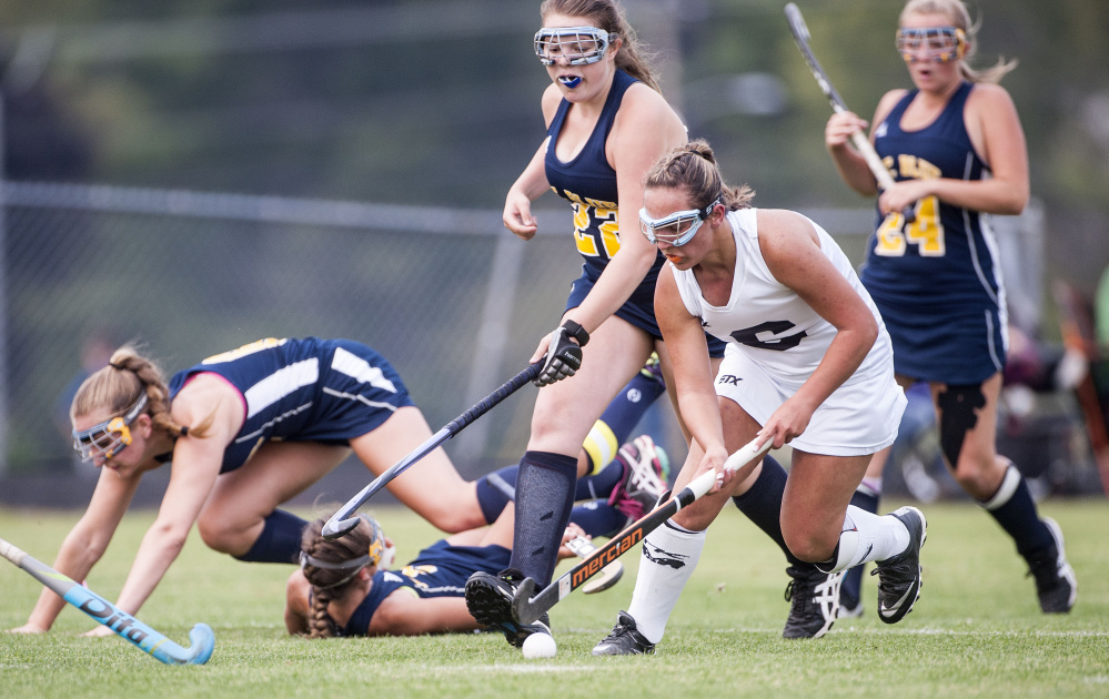 Skowhegan senior Alexis Vashon, front, drives past a group of Mt. Blue  defenders during the first half of a Kennebec Valley Athletic Conference Class A game Tuesday in Skowhegan.
