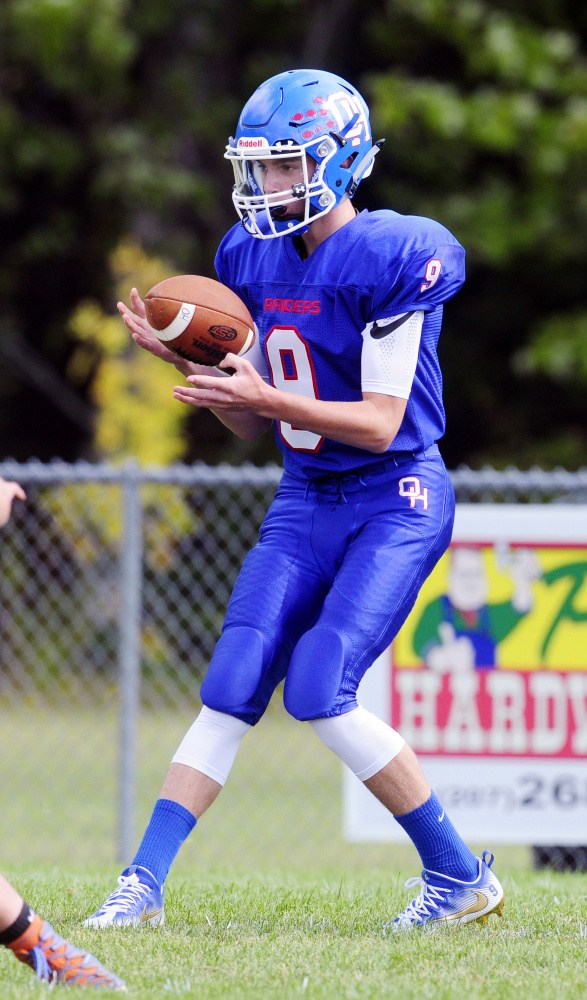 Oak Hill's Gavin Rawstron takes the shotgun snap during a game against Yarmouth on Saturday at Oak Hill High School in Wales.