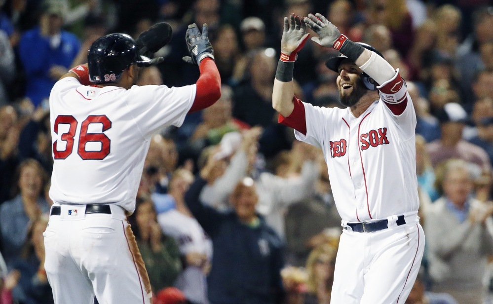 Boston second baseman Dustin Pedroia, right, celebrates his two-run home run that also scored Eduardo Nunez during the first inning of a game last Saturday.