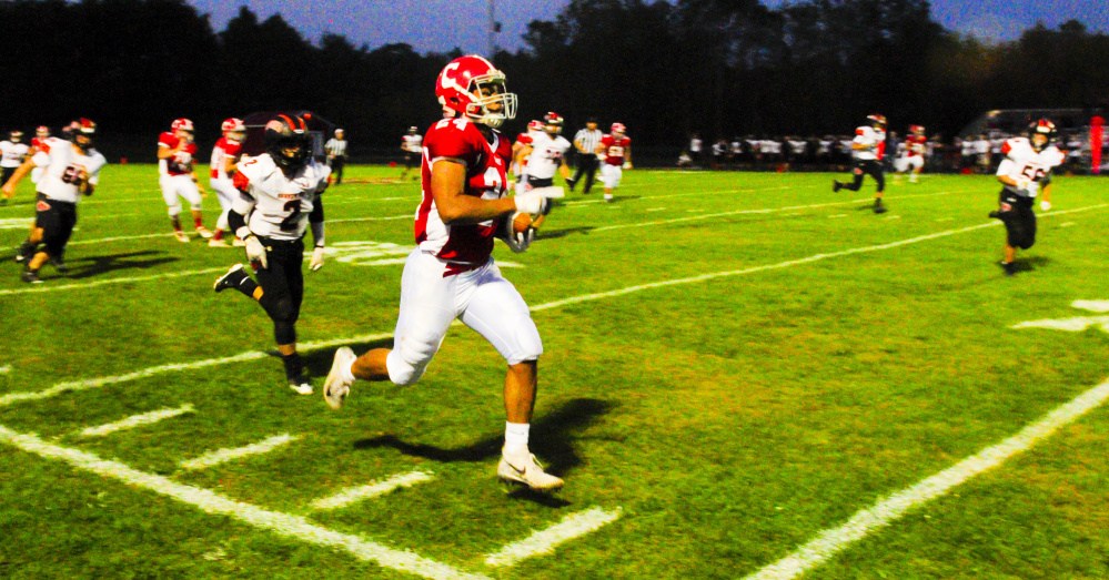 Cony receiver Jordan Roddy runs along the sidelines for a touchdown on a long pass play to put the Rams up 6-0 over Brunswick in first quarter of a Pine Tree Conference Class B game Friday night at Alumni Field in Augusta.