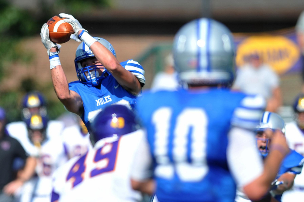Colby College's Andrew DeFranco (28) makes a catch in tight coverage by Williams College on Saturday at Colby College in Waterville.