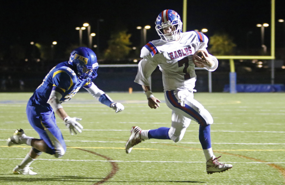 Falmouth defender Garrett Aube can't quite catch Messalonskee running back Tyler Lewis as he makes his way to the end zone for a touchdown during a Class B game Friday night in Falmouth.