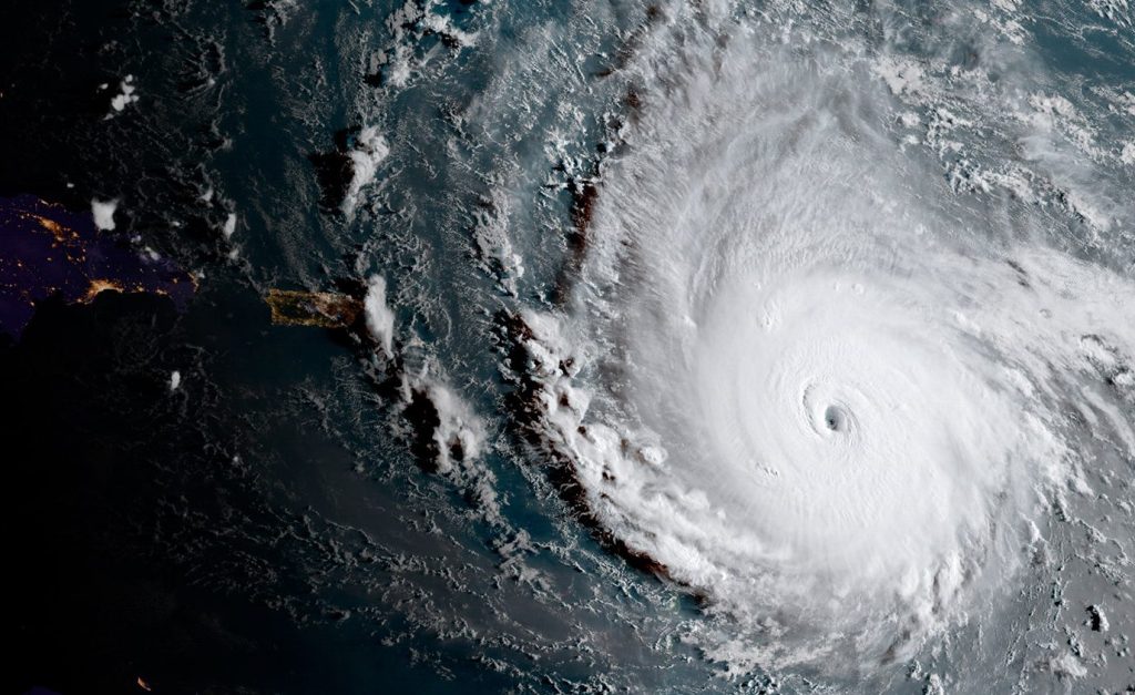 This image released by the National Oceanic and Atmospheric Administration shows Hurricane Irma moving west Tuesday morning toward the Leeward Islands. Irma grew into a Category 5 hurricane, the most powerful in the Atlantic in over a decade, and roared on a path that could take it to the United States.