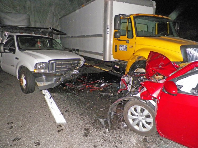 A car traveling the wrong way on the Maine Turnpike struck construction vehicles parked under the Boom Road overpass in Saco early Monday. 