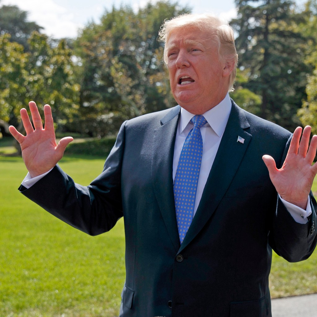 President Donald Trump talks to reporters as he walks to board Marine One on the South Lawn of the White House, Wednesday, Sept. 27, 2017, in Washington. (AP Photo/Evan Vucci)