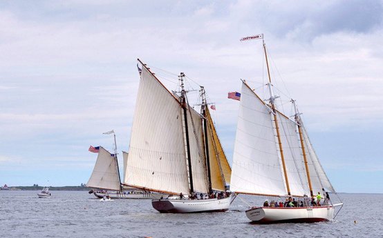 The schooners Eastwind, Spirit of Massachusetts and Harvey Gamage, right to left, sail around Boothbay Harbor in this June 27, 2012 file photograph.