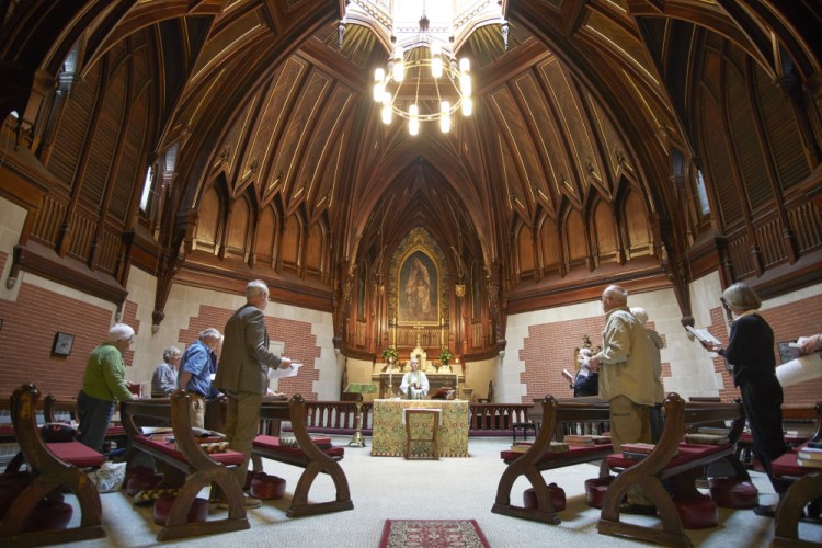 The Rev. Ben Shambaugh starts a service at St. Luke's Cathedral in Portland at noon on Tuesday after opening the church for a national time of prayer for the victims in the Las Vegas shooting.