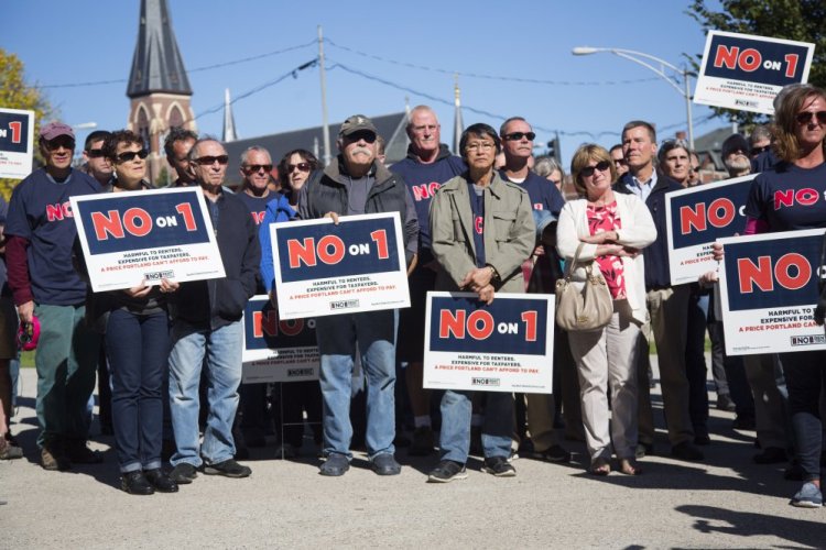 Opponents of Portland's rent stabilization ballot question rally in Lincoln Park on Oct. 12. Critics of the measure say it would violate state law by changing the eviction process.