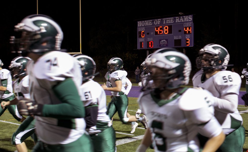 The Bonny Eagle Scots, left, beat the Deering High School Rams on Friday, 51-0. The Maine Principals' Association has tried to make high school football more competitive, with little success.