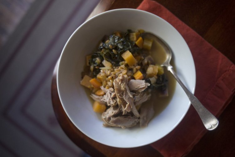 Mustard-braised turkey shanks with rye berries and greens.