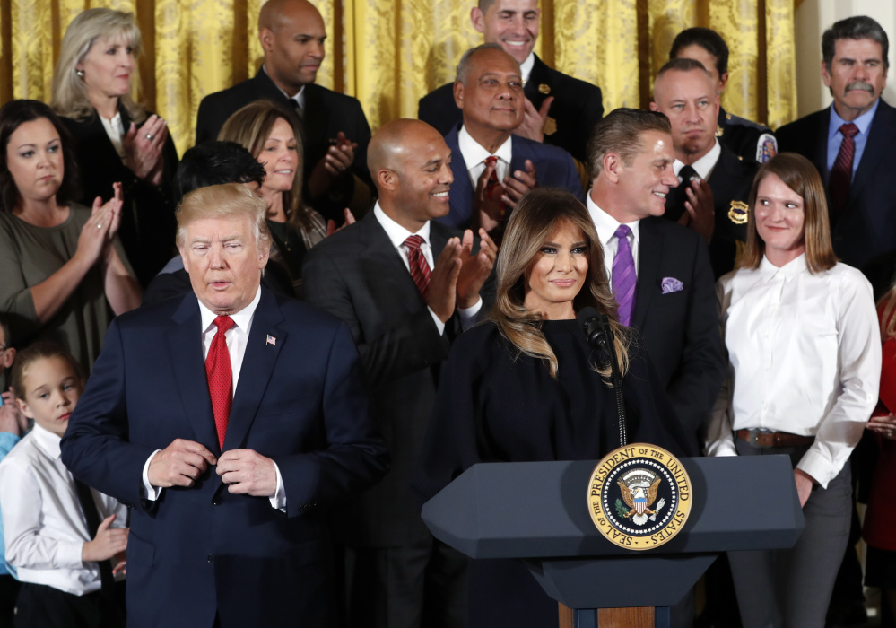 President Trump and first lady Melania Trump arrive to speak on combating the opioid crisis, in the East Room of the White House in Washington on Thursday.