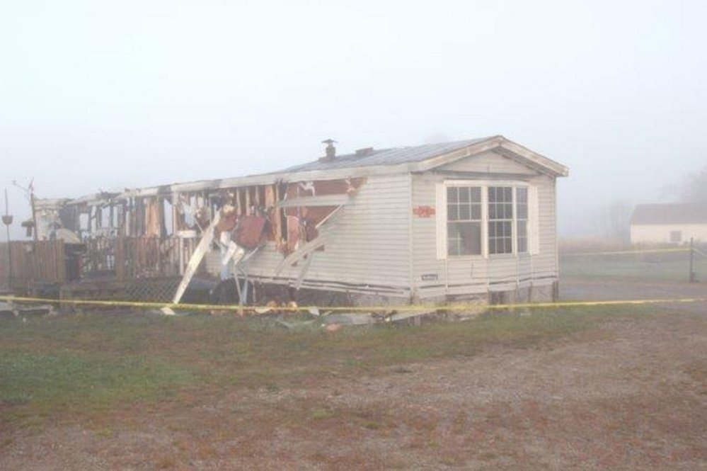 The remains of 54 Middle St. in Whitneyville were surrounded by police tape on Saturday, Oct. 28, 2017. The Fire Marshal's Office and Maine State Police are investigating the fire after a body was discovered inside the home.