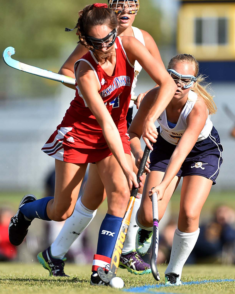 Messalonskee midfielder Haley Lowell (14) battles for the ball with Mt. Blue's Hailey Frost during a Class A North game earlier this season in Farmington.