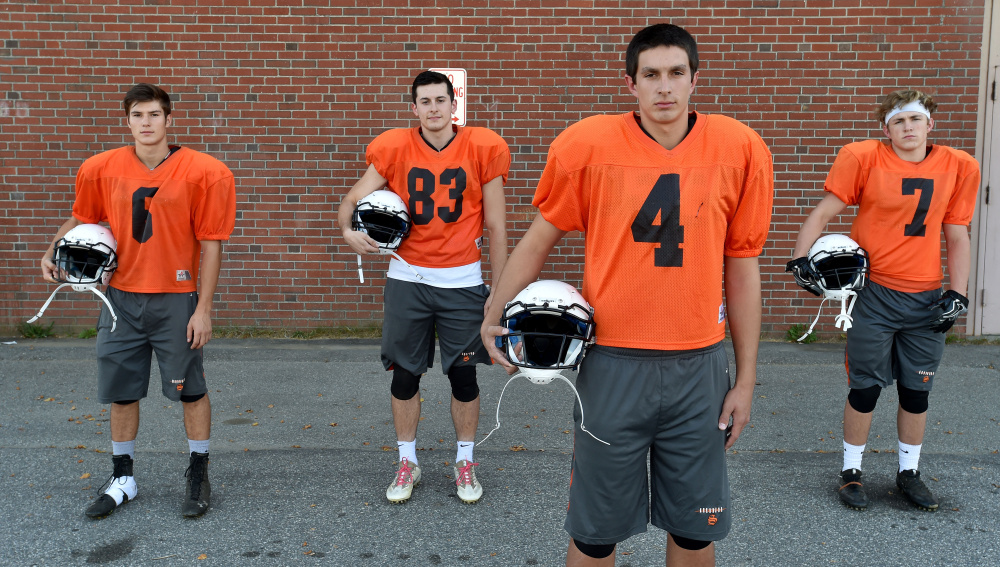 Skowhegan quarterback, Marcus Christopher, right foreground, stands with his top receivers, from back left, Sean Savage, Cam Barnes, and Jon Bell on Wednesday afternoon.