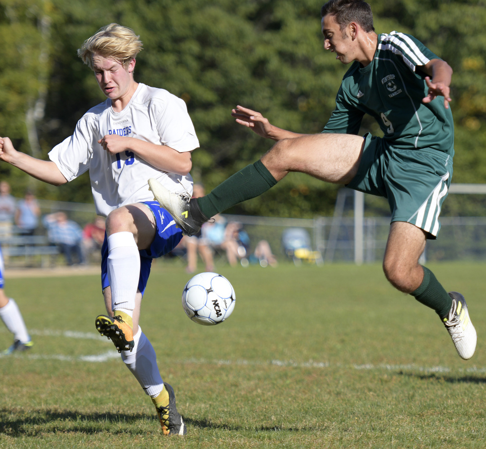 Oak Hill's Max Hall, left, defends Winthrop's Jared McLaughlin during a Mountain Valley Conference game Wednesday afternoon in Wales.