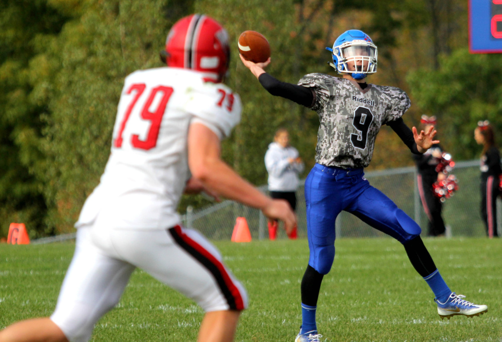 Oak Hill High School freshman quarterback Gavin Rawstron throws a touchdown pass to Darryn Bailey during the first half of a recent home game against Wells High School.