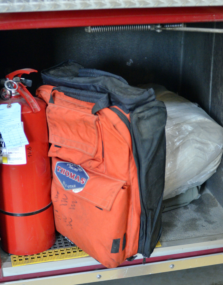 First aid equipment such as this orange pack seen Thursday are included in the gear on two firetrucks at the Richmond fire station.