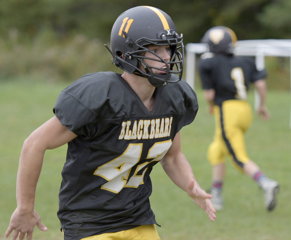 Maranacook linebacker Dakota DeMott prepares to make a play during practice Wednesday in Readfield.