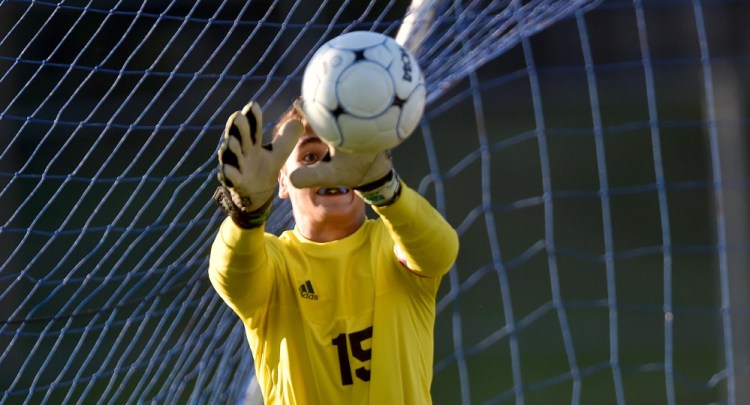 Messalonskee goalie Chase Warren (15) makes a save against Mt. Blue on Thursday in Oakland.