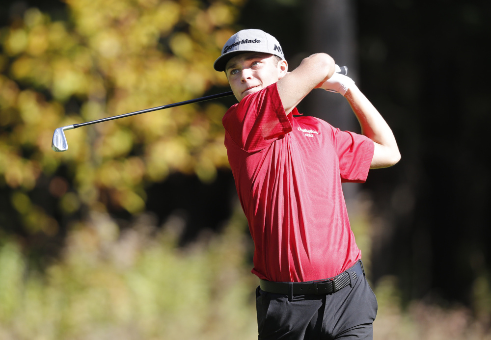 Camden Hills' Cole Anderson tees off during the Class A boys individual state golf championship at Natanis Golf Course on Saturday in Vassalboro. Anderson tied with Anthony Burnham for first place.