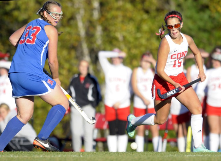 Mt. Ararat's Katherine Trebilcock, left and Cony's Faith Leathers-Pouliot chase down a ball during a Class A North quarterfinal game Tuesday in Augusta.