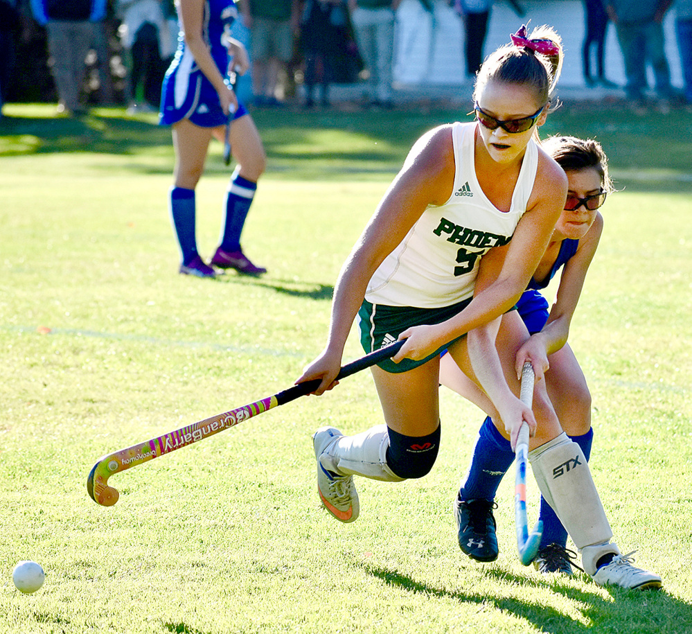 Spruce Mountain's Avery Williams (5) and Oak Hill's Kayla Robichaud (7) battle for the ball in a Class C South quarterfinal game Wednesday in Jay.
