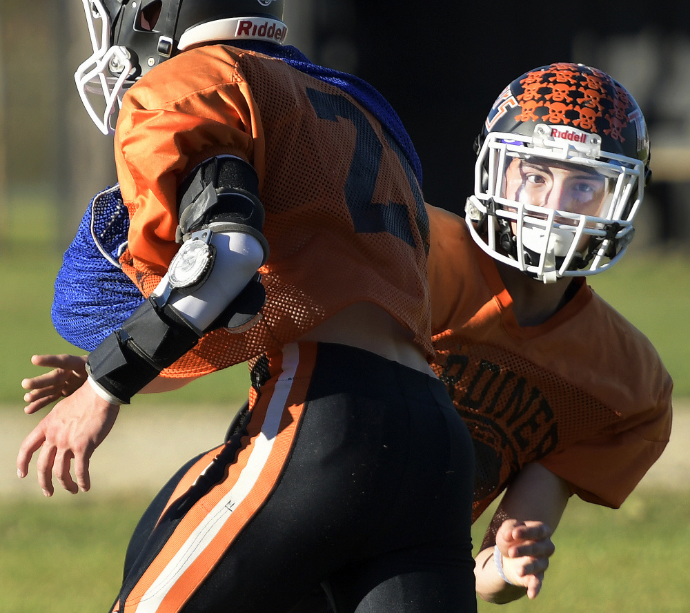 Gardiner Area High School linebacker Garrett Maheux runs drills at practice Wednesday in Gardiner.