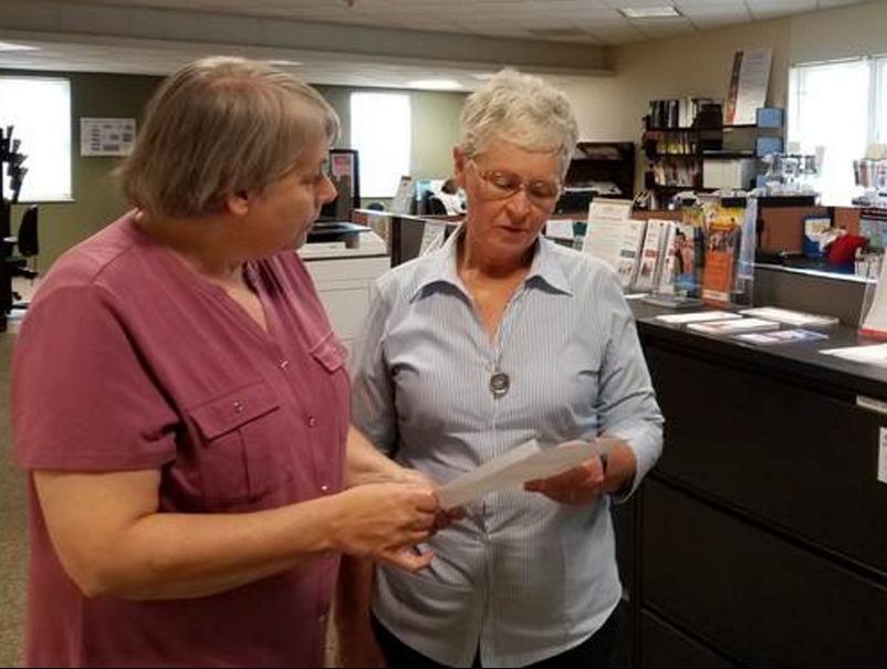 Patty Ladd left, a manager at CareerCenters in Wilton and Rumford, talks with fellow staff member Pat Morse on Monday at the Wilton office. Ladd and Morse are among the 14 employees of Western Maine Community Action who received conditional layoff notices effective Oct. 31, in connection with Gov. Paul LePage's rejection of federal Workforce Innovation and Opportunity Act job training funding.