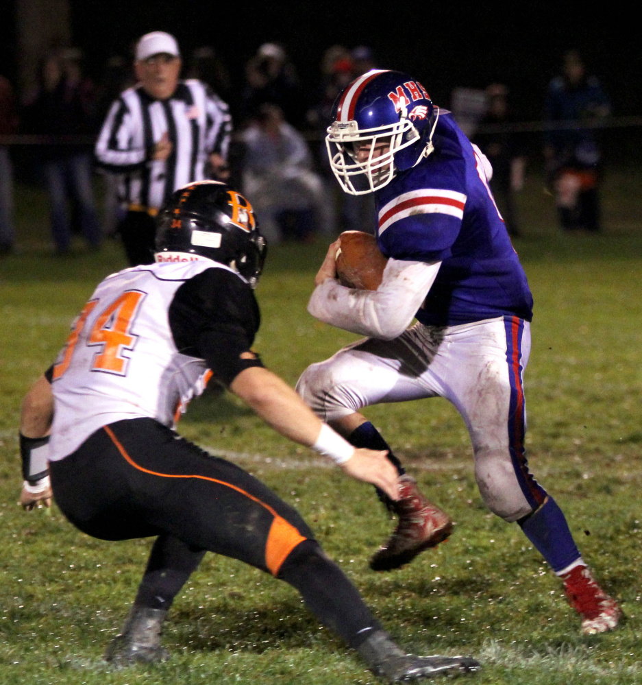 Messalonskee's Cameron Goff tries to step past Brewer defender Bryce Largay during first-half action in Oakland on Friday night.