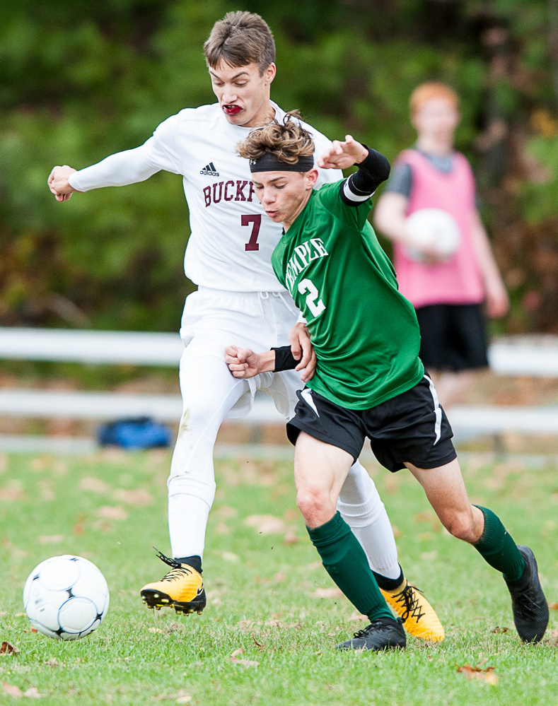 Sun Journal photo by Russ Dillingham 
 Buckfield's Ethan Jackson (7) and Temple's Micah Riportella vye for a 50/50 ball during the first half of Tuesday's Class D South semifinal game in Buckfield.