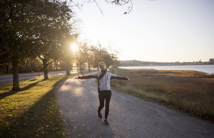 Elizabeth Peavey rehearses lines while walking briskly walking along the Back Cove. Peavey is rehearsing for her one woman show "My Mother's Clothes Are Not My Mother" which opens on Nov. 10 in Lewiston. Peavey said she can't run lines inside and when she walks outside the "words move through her."