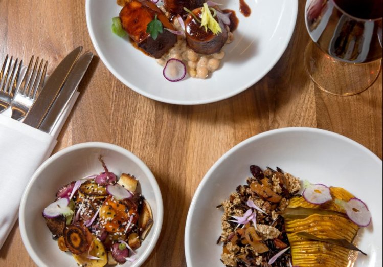 The vegan Thanksgiving dinner at Sea Glass at the Inn by the Sea in Cape Elizabeth will include, clockwise from top, carrot osso bucco with braised chickpeas, Hasselback butternut squash with wild rice and oat dressing, and roasted root vegetables with maple, soy and sesame.