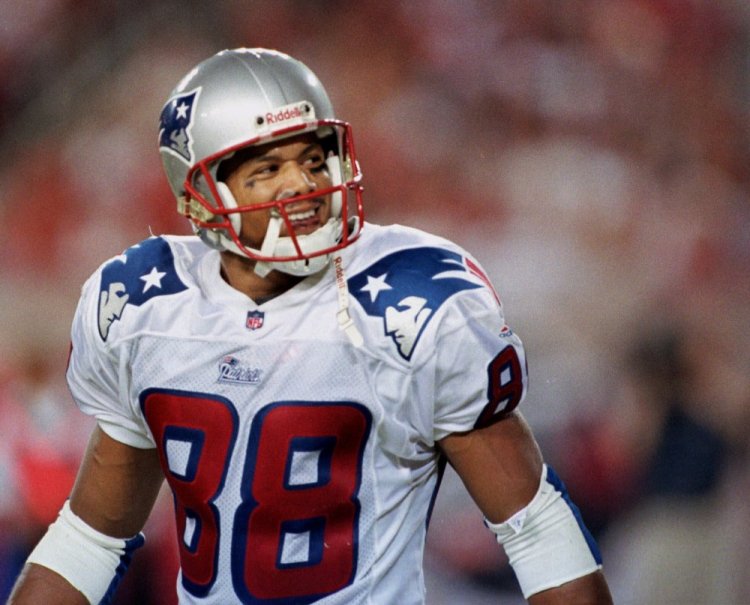 New England wide receiver Terry Glenn looks back after catching a touchdown pass from quarterback Drew Bledsoe against the Buccaneers in Tampa, Fla. in 1999. Officials say Glenn died following a one-vehicle rollover traffic accident near Dallas that left his fiancée slightly hurt.