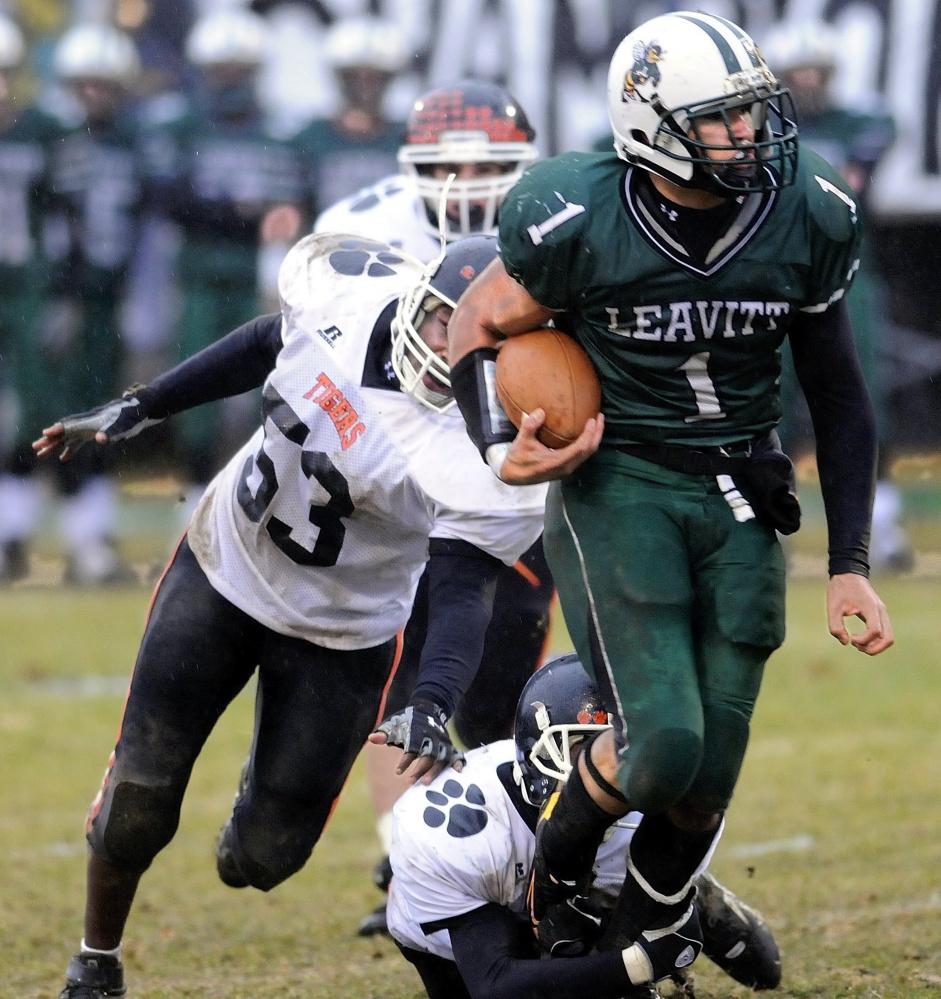 Staff file photo by Andy Molloy 
 Leavitt's Josh Strickland out-runs a few Gardiner defenders during the 2009 Pine Tree Conference Class B championship game in Turner.