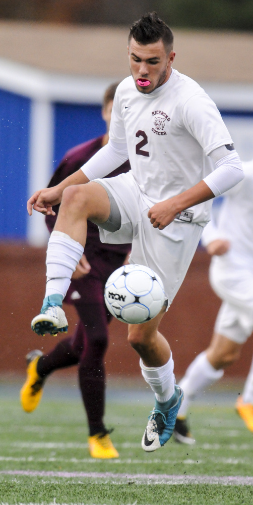 Richmond's Matt Rines kicks the ball against Buckfield in the Class D South championship game Thursday at McMann Field in Bath.