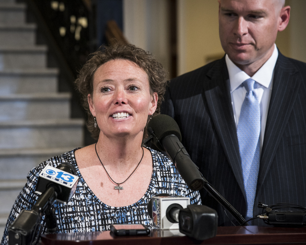 Toni Richardson, center, an education technician in the Augusta School Department, addresses news media representatives earlier this year at a news conference in the State House Hall of Flags in Augusta. She is joined by her attorney Jeremy Dys, left, of the First Liberty Institute, a legal organization that specializes in defending religious freedom.