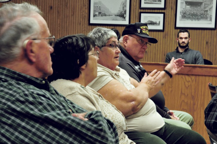 Waterville resident Linda Woodside asks a question of officials Monday during a meeting regarding the Trafton Road project at City Council in Waterville.