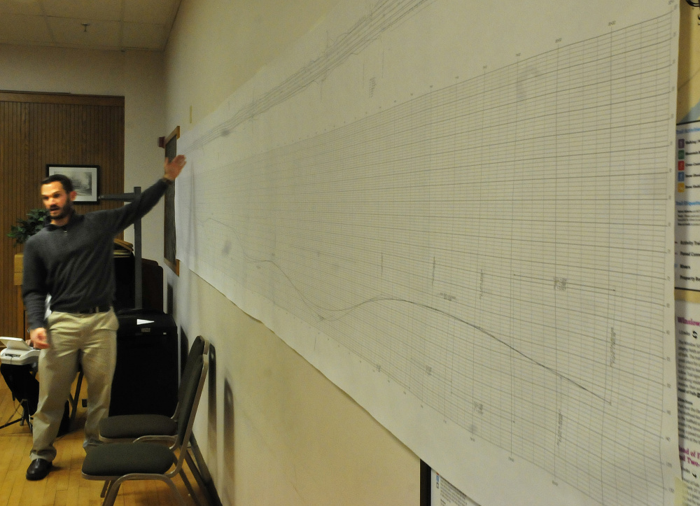 Nick Hartley of the Maine DOT uses a chart to explain how Trafton Road dimensions will be altered, during a meeting Monday on the Trafton Road project at City Council in Waterville.