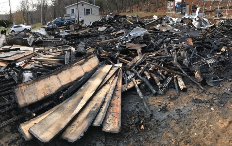 Fire destroyed this garage early Tuesday morning at 222 Hunts Meadow Road in Whitefield.