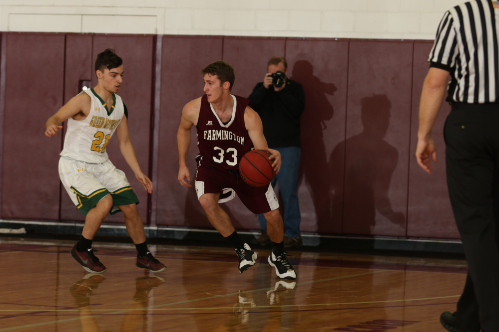 University of Maine at Farmington guard and Mt. Blue graduate Eric Berry dribbles during a game last season.
