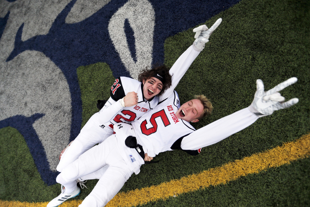 Scarborough's Jeremy Sendrowski, left, and Connor Kelly celebrate after beating Windham in the Class A state championship Saturday at Fitzpatrick Stadium. (Staff photo by Ben McCanna/Staff Photographer