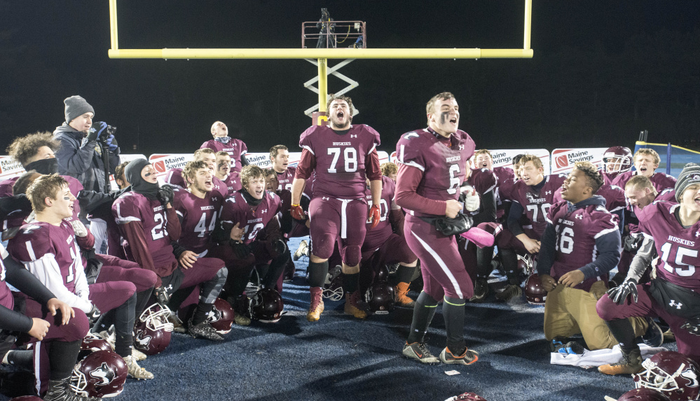 Maine Central Institute celebrates its victory over Cape Elizabeth in the Class C state championship game Friday night at the University of Maine in Orono.