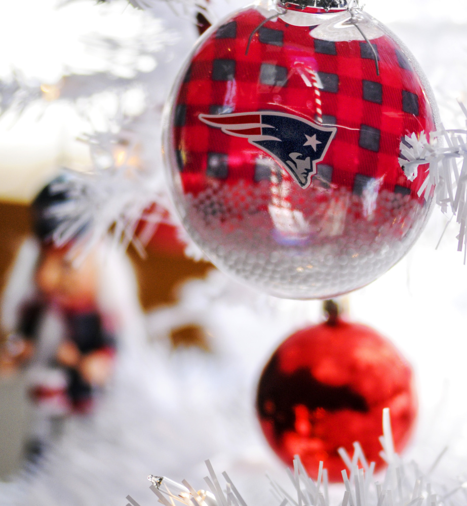 A tree sponsored by Capitol Computers features Patriots ornaments in the River of Trees event Friday in downtown Augusta.