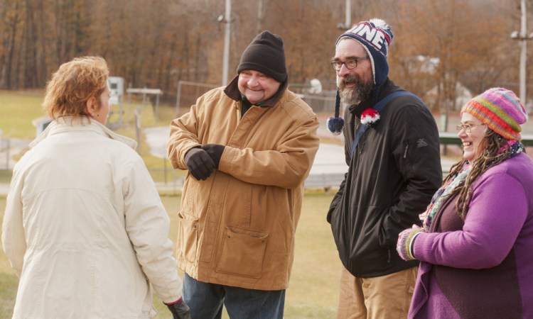 Town Council candidates Anthony "Andy" Wess, second from left, David Hughes and Faith Benedetti greet a voters Tuesday at the Winthrop Town Office.