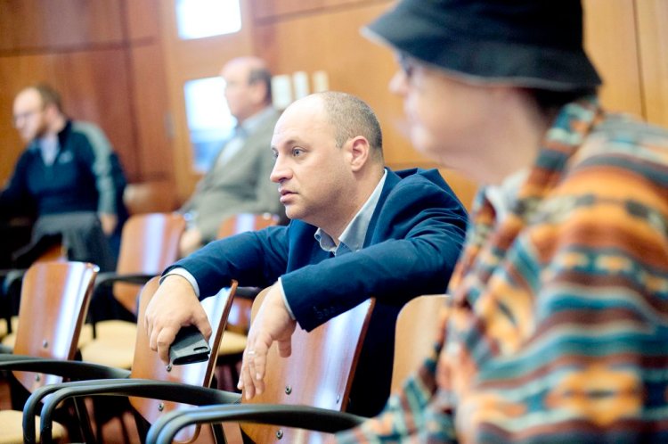 Jason Levesque watches the mayoral election recount at Auburn Hall on Tuesday. 