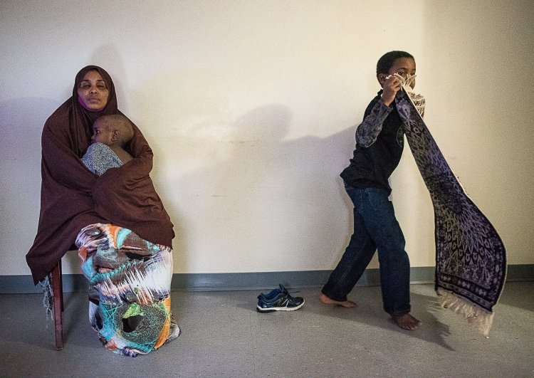 "Kadra Ahmed"&nbsp;sits in her living room in Lewiston with her 2-year-old son, who was diagnosed with lead poisoning while living at their former apartment. Her 9-year-old son picks up his prayer rug.&nbsp;"All our life is dependent on his sickness," Ahmed said through an interpreter. "Our life is just changing."&nbsp;
