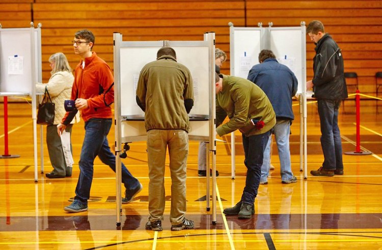 Long lines keep the Deering High School voting booths bustling in Portland on November 8, 2016. Mainers will decide on several high-profile statewide and local ballot questions this Tuesday. 